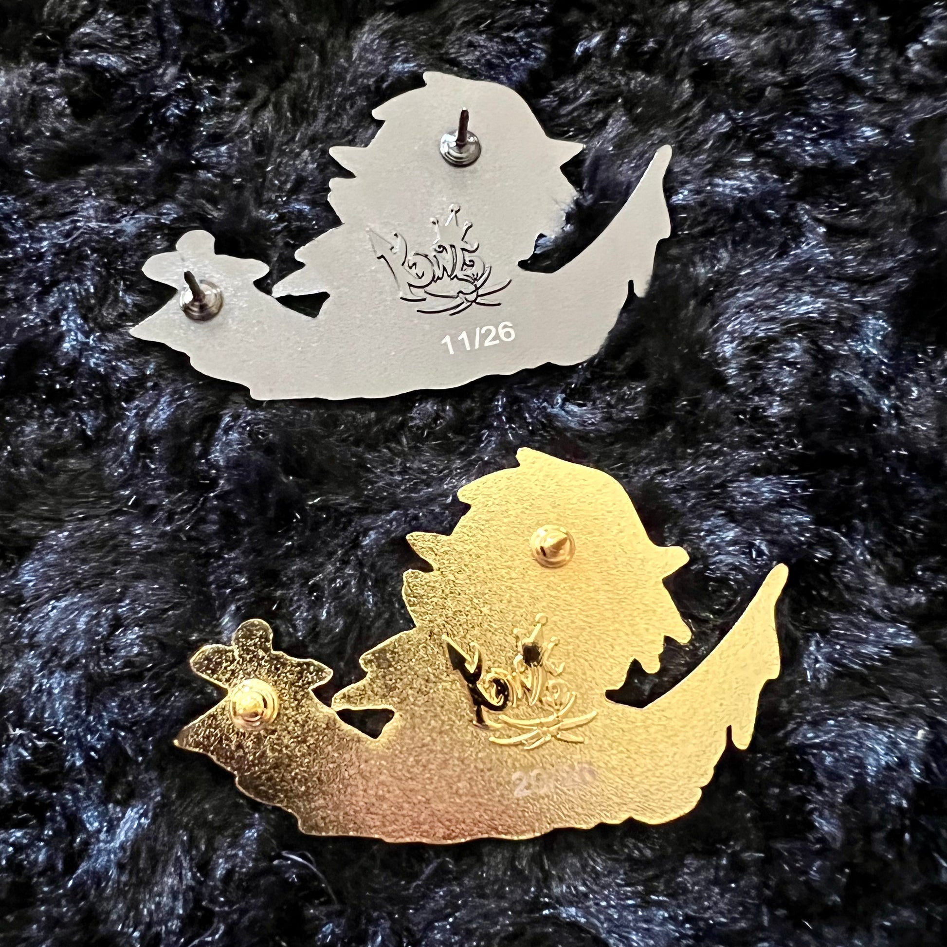 Kingdesigns26 water-themed pins, featuring detailed designs, displayed on a neutral background.