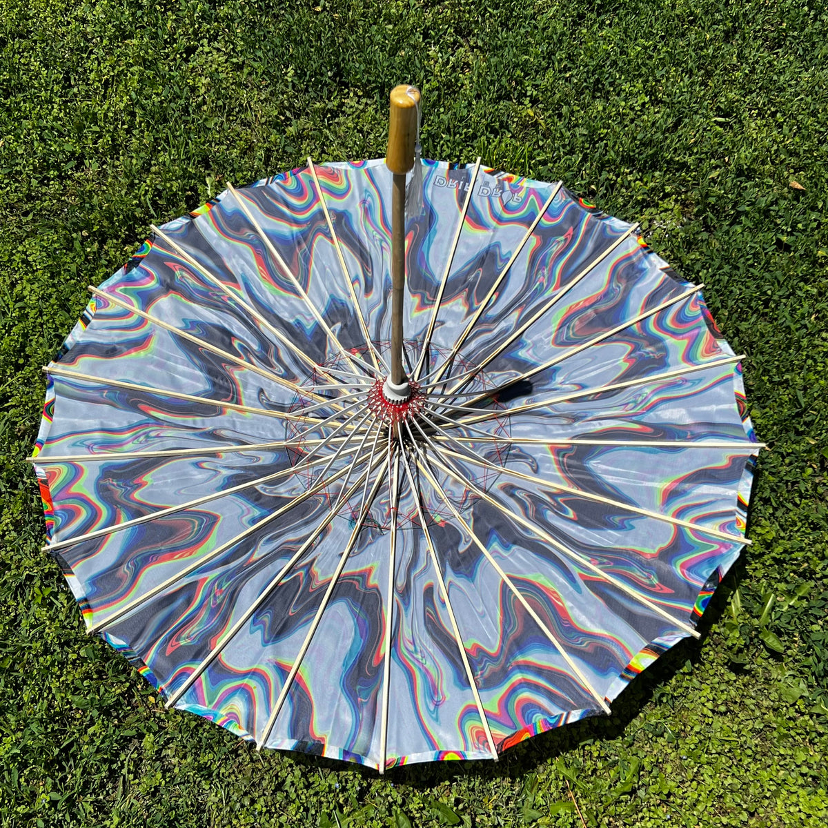 White Chromatic OG Parasol by Drip Drop Labs featuring a sleek white canopy and stylish parasol design.
