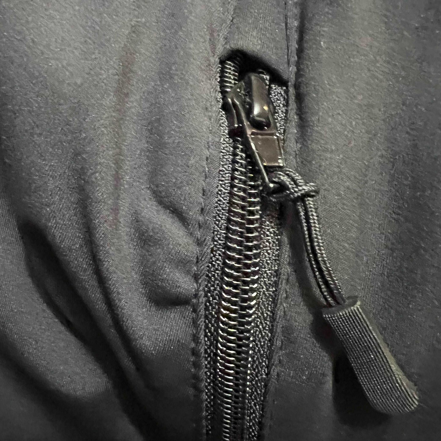 Drip Drop Labs DDL athletic joggers in black, made of lightweight fabric with a relaxed fit and elastic waistband.