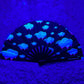 Juicy Drip Glow Fan by Drip Drop Labs, a vibrant LED fan with colorful glow effects, perfect for fans and outdoor use.