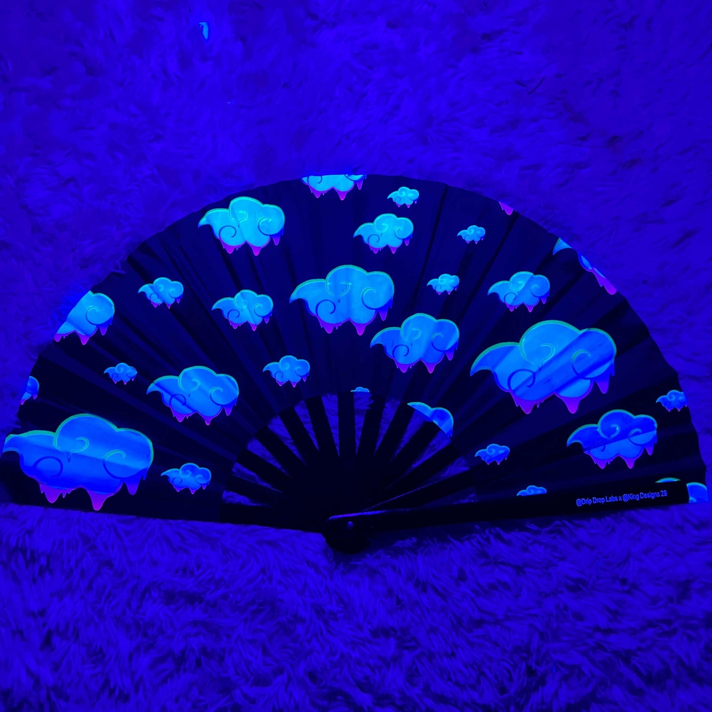 Juicy Drip Glow Fan by Drip Drop Labs, a vibrant LED fan with colorful glow effects, perfect for fans and outdoor use.