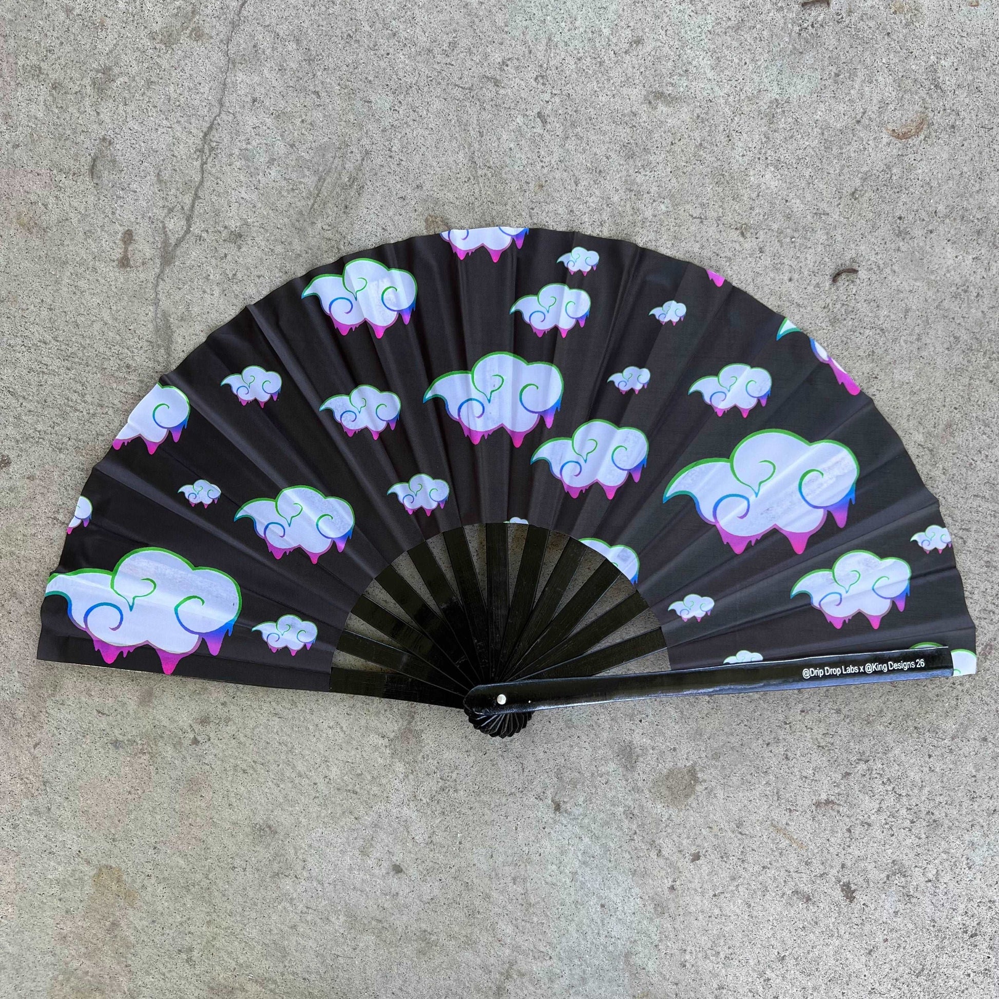 Juicy Drip Glow Fan by Drip Drop Labs, colorful fan with vibrant glow effects and unique drip design for stylish cooling.