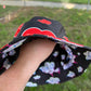 Reversible Juicy Drip Bucket Hat by Drip Drop Labs with colorful drip pattern and wide brim for sun protection.