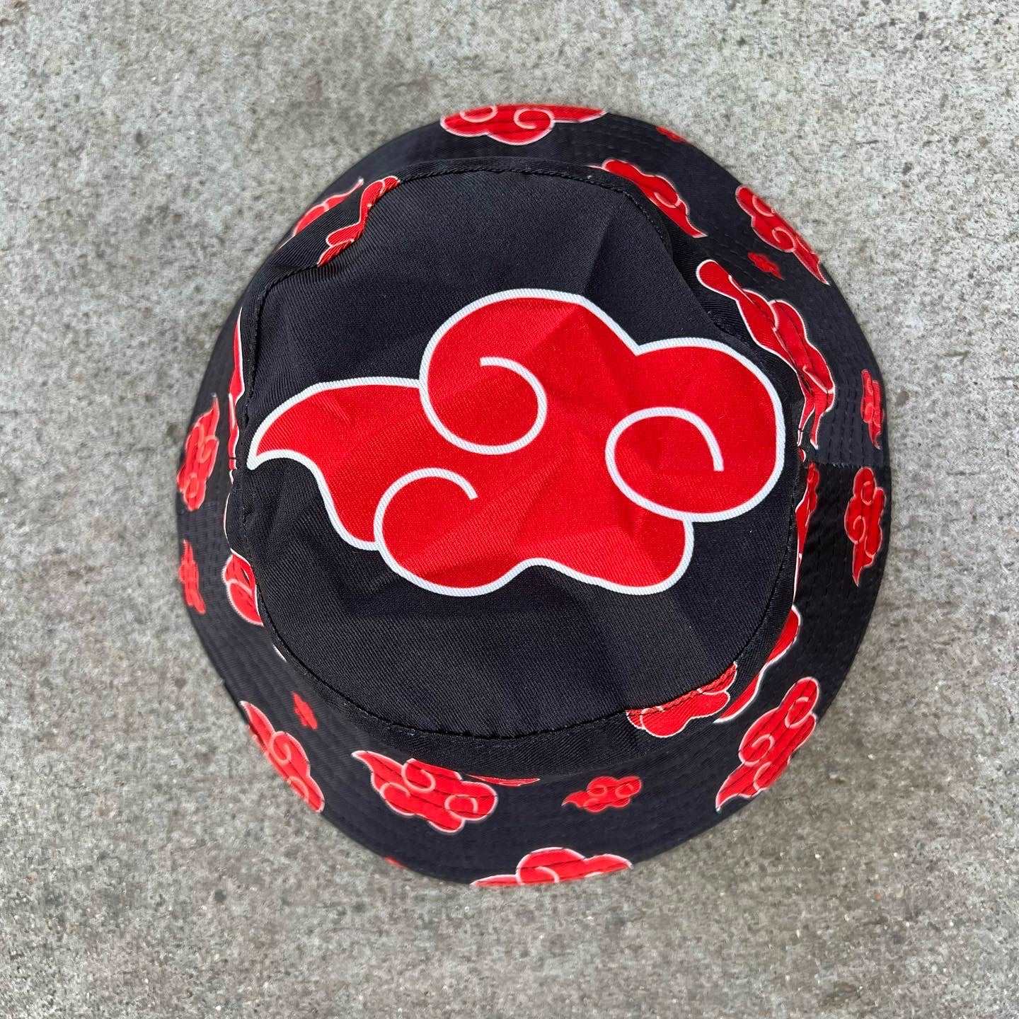 Juicy Drip Reversible Bucket Hat by Drip Drop Labs, colorful and stylish hat with vibrant drip pattern, worn on a model.