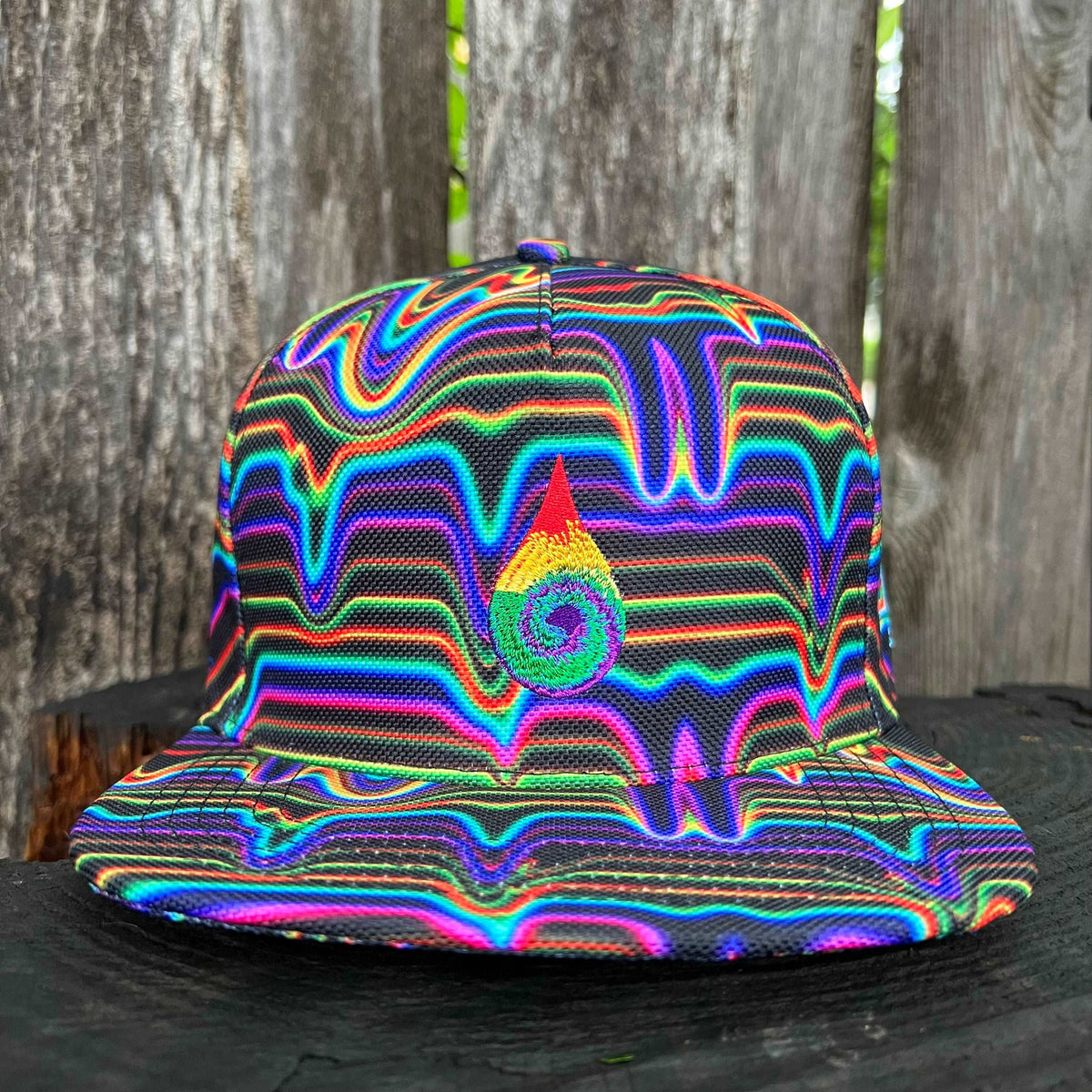 Black Drip Drop Labs snapback hat with flat brim and embroidered logo, stylish and adjustable for a comfortable fit.