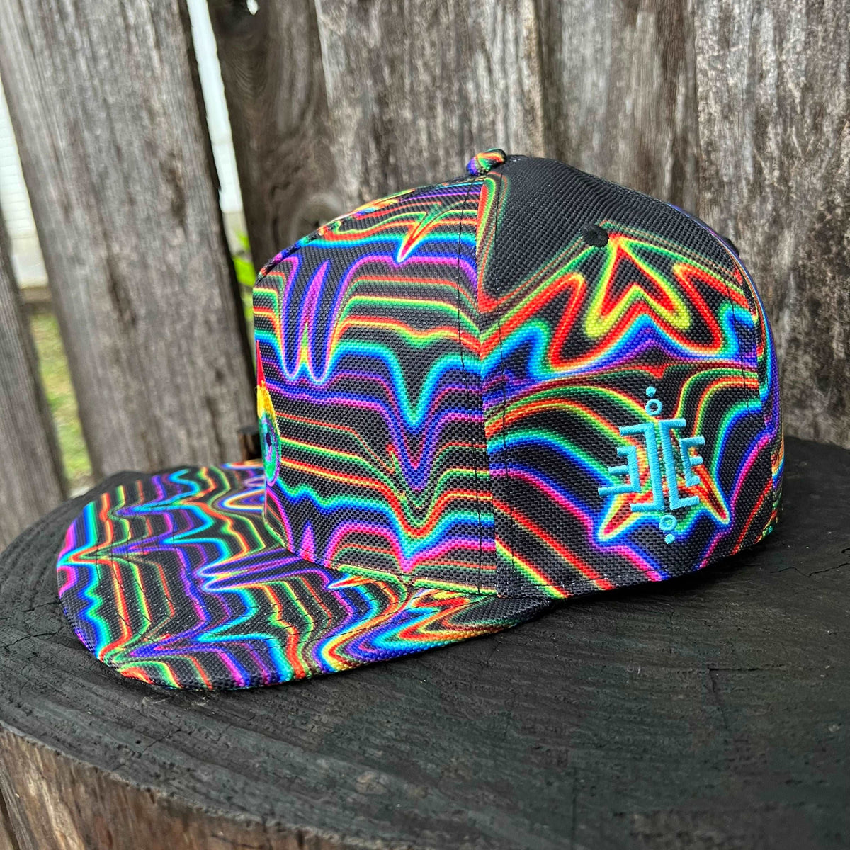 Drip Drop Labs SnapBack Hat featuring a structured design, flat brim, and adjustable strap in black with logo embroidery.