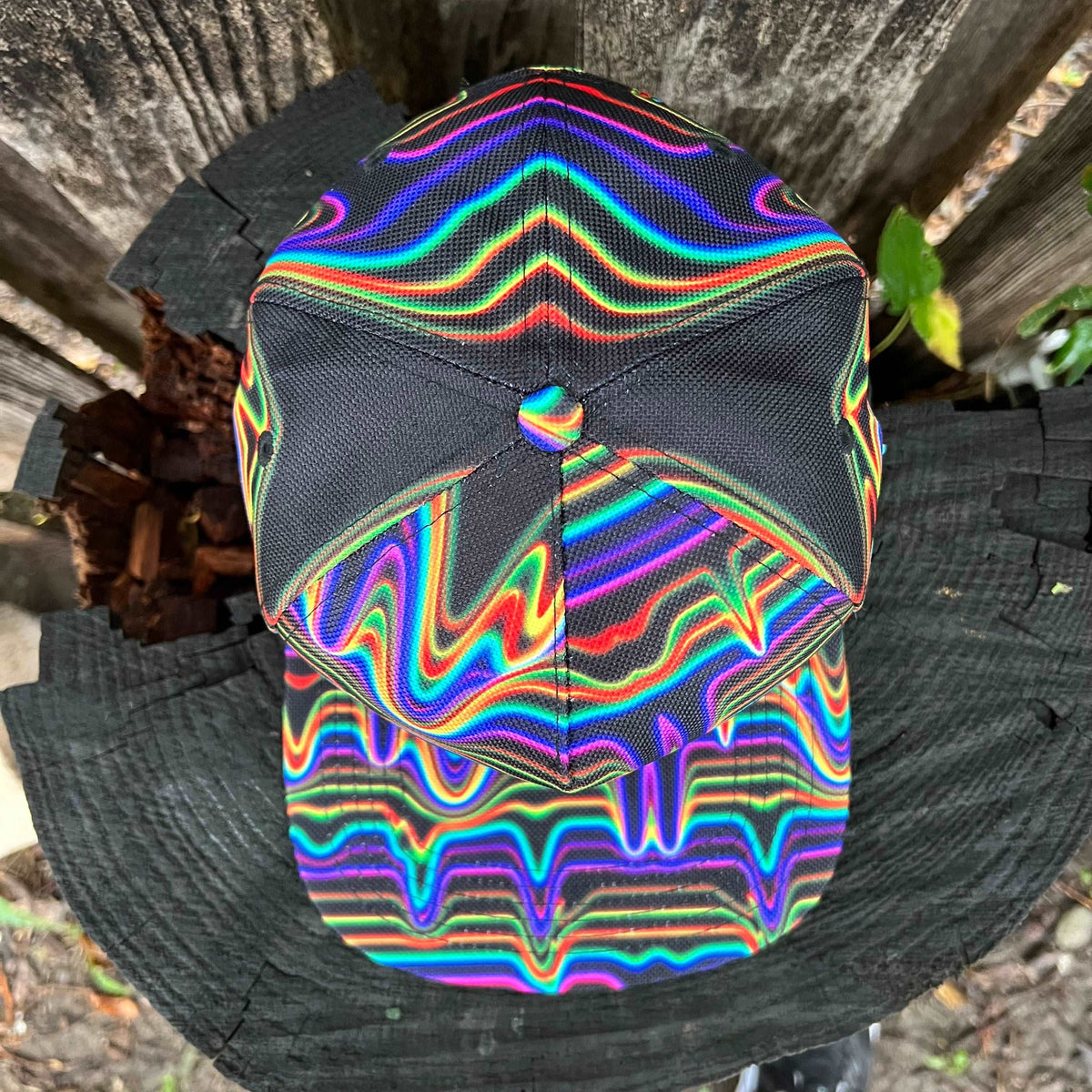 Black SnapBack hat by Drip Drop Labs with adjustable strap and embroidered logo, front view showcasing stylish design.