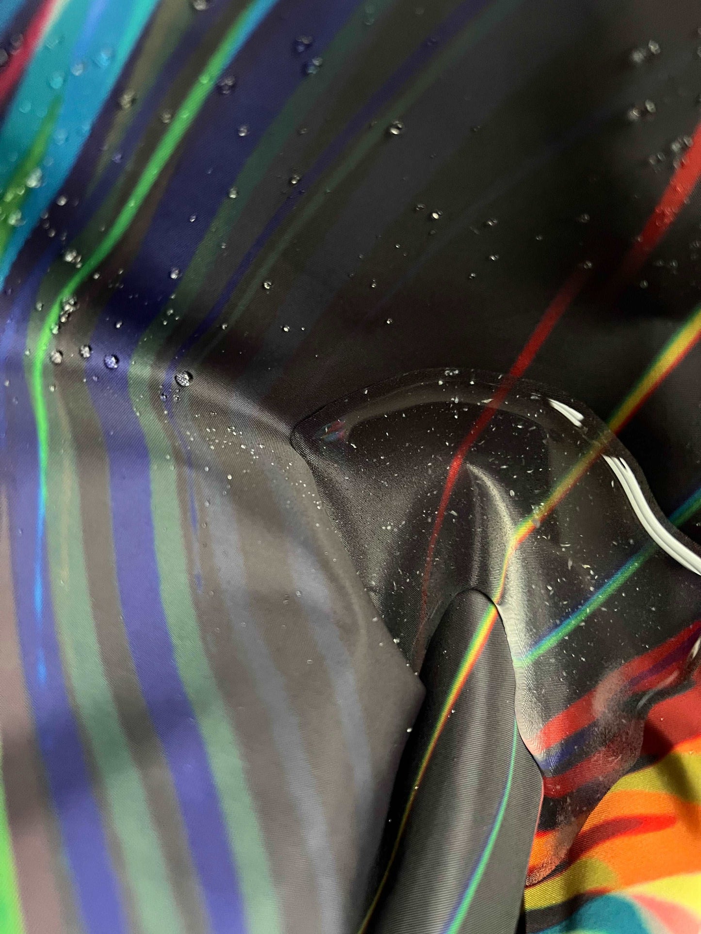 Black windbreaker jacket by Drip Drop Labs from the Super Future collection, featuring a sleek design and lightweight fabric.