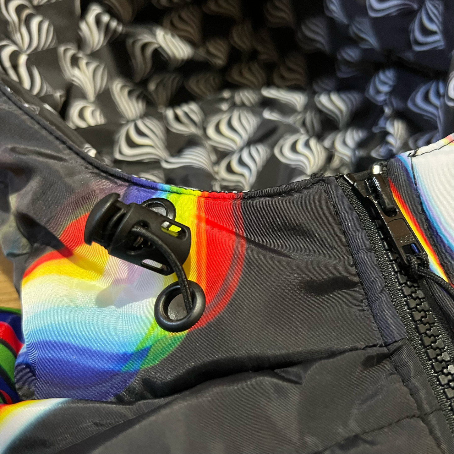 Black winter coat by Drip Drop Labs featuring a sleek design and insulated fabric for cold weather comfort.