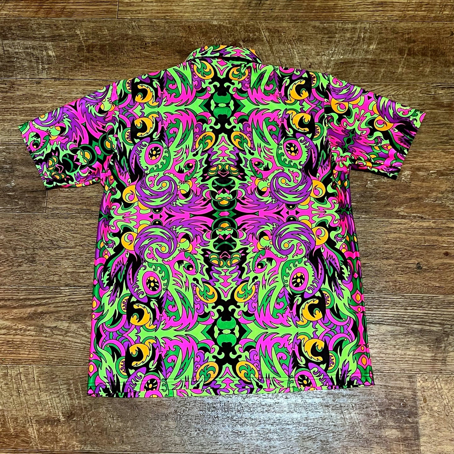 Drip Drop Labs Wild Forest UV Polo shirt featuring a nature-inspired print, short sleeves, and breathable fabric.