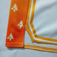 Drip Drop Labs Zen Forest Orange basketball shorts featuring vibrant orange fabric and sporty design.