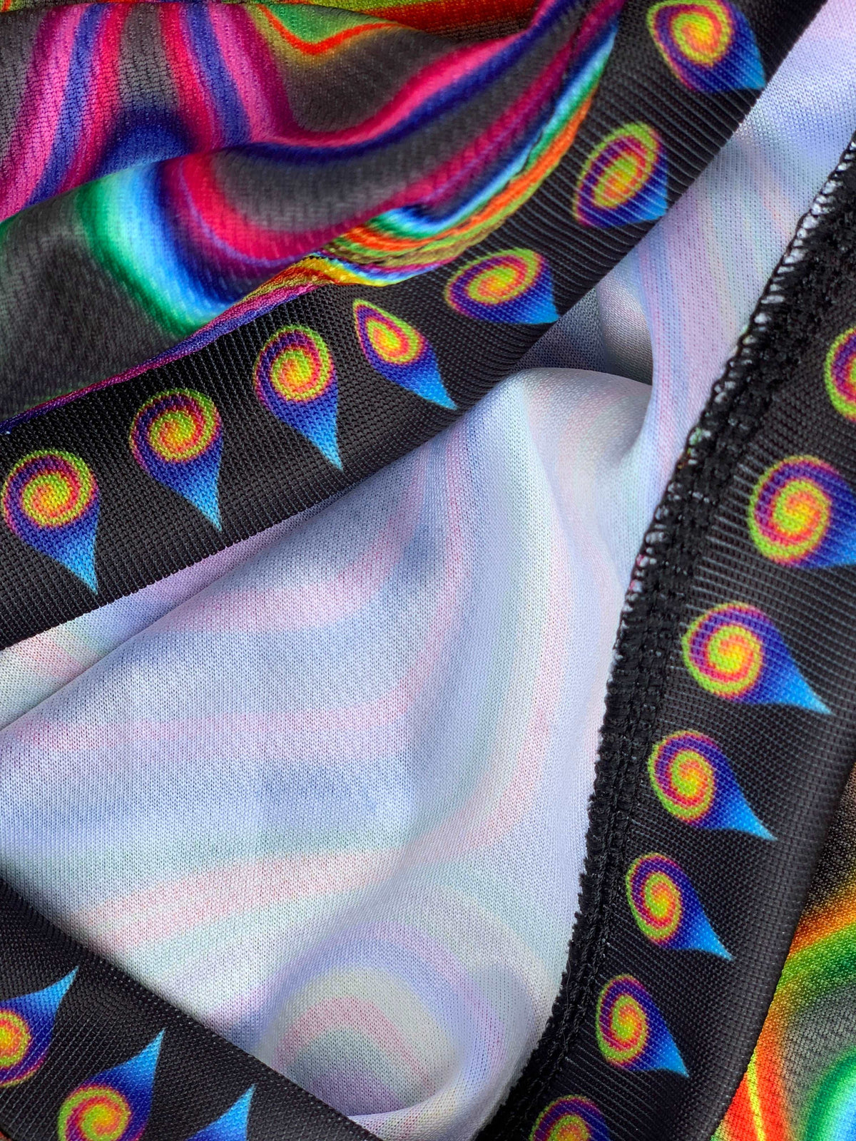 Electric Goo basketball jersey by Drip Drop Labs, featuring vibrant colors and athletic fit, displayed on a hanger.