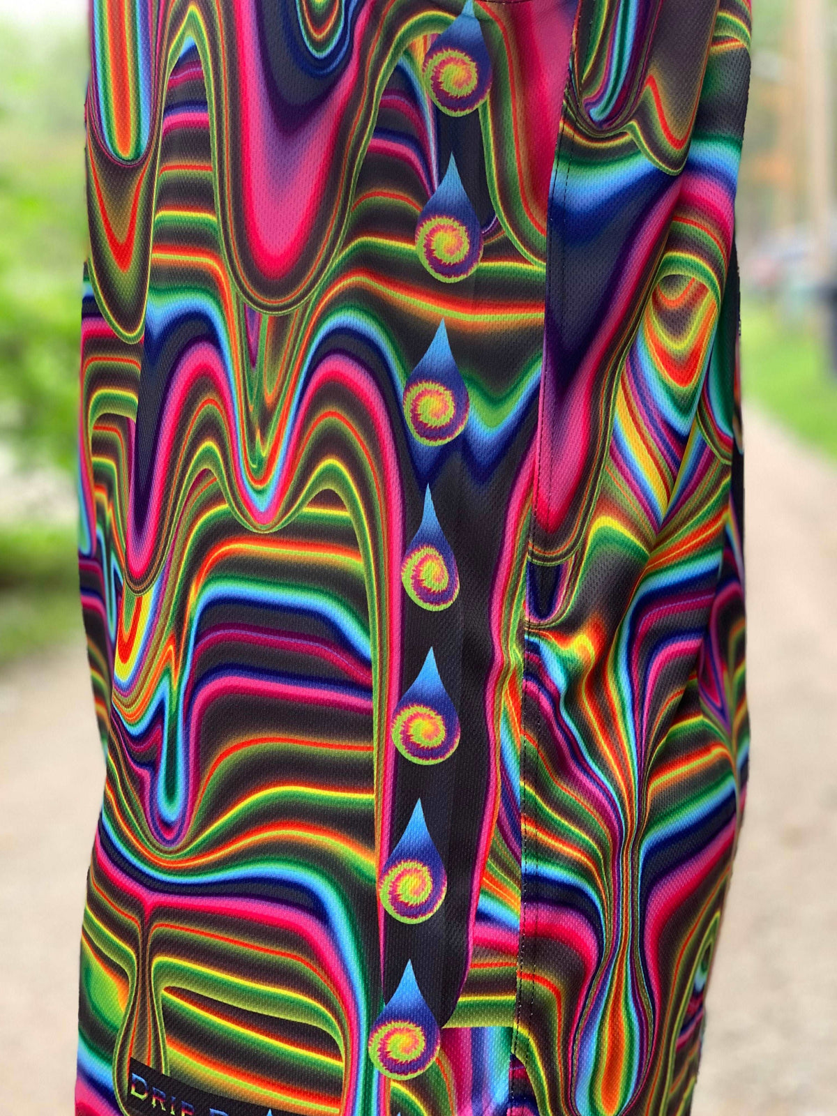 Electric Goo basketball jersey by Drip Drop Labs featuring vibrant colors and athletic fit, displayed on a mannequin.