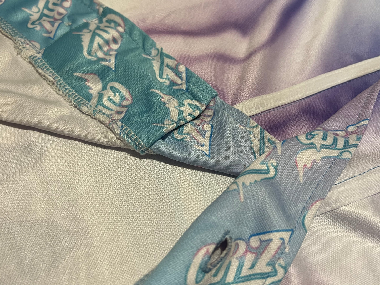 Drip Drop Labs GrizDrip v5 hooded baseball jersey with black and gray design, featuring front logo and sporty hood detail.