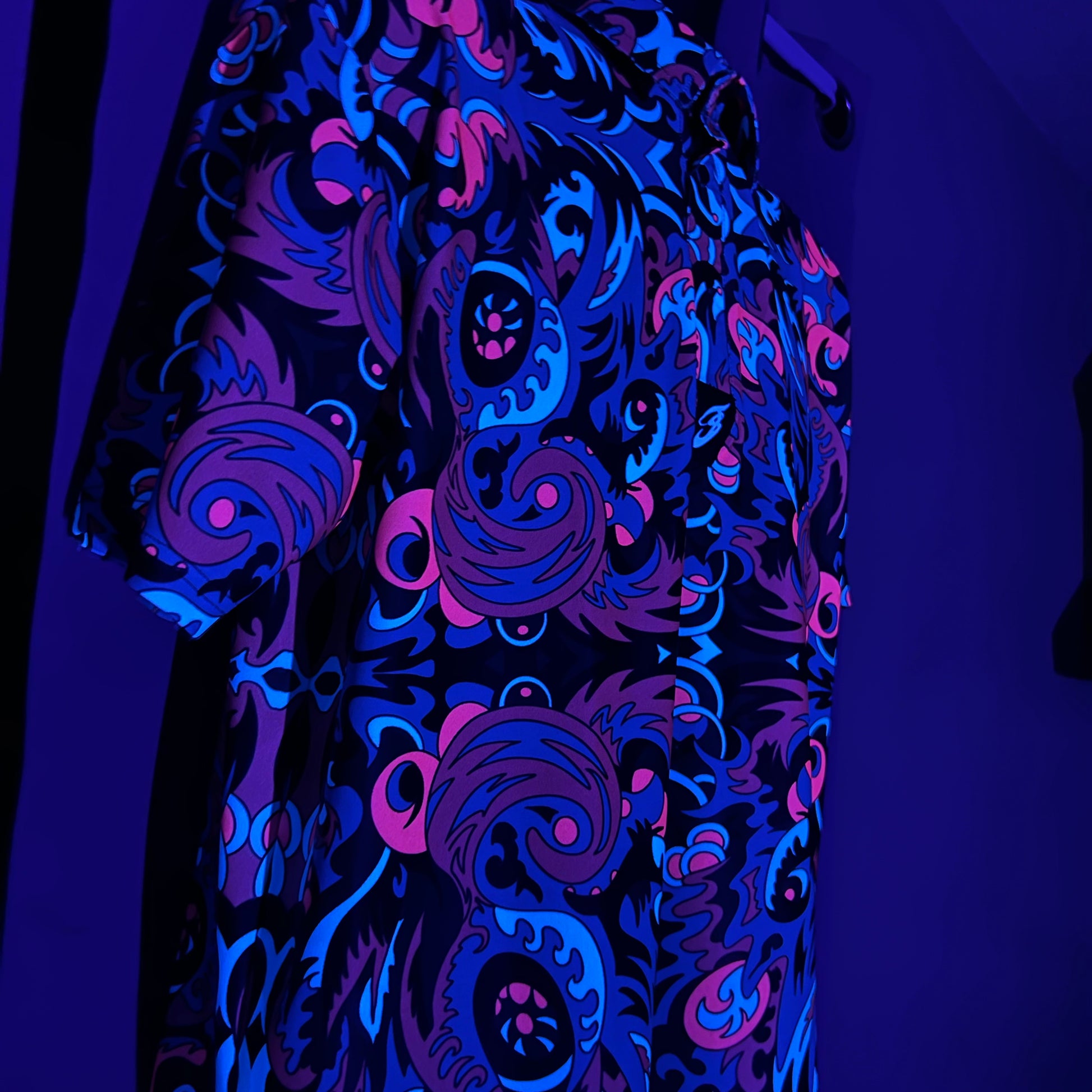 Drip Drop Labs Midnight Forest UV Polo shirt with a dark forest print, showcasing its stylish design and UV-reactive fabric.