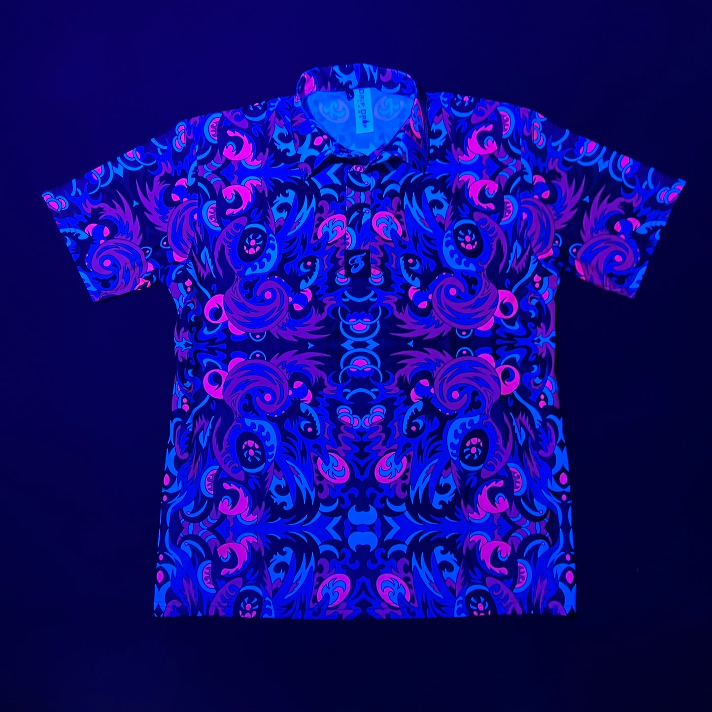 Drip Drop Labs Midnight Forest UV Polo shirt featuring a dark forest pattern and UV-reactive design on soft fabric.