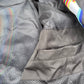 Black windbreaker jacket from Drip Drop Labs' Super Future collection, featuring a sleek design and lightweight material.