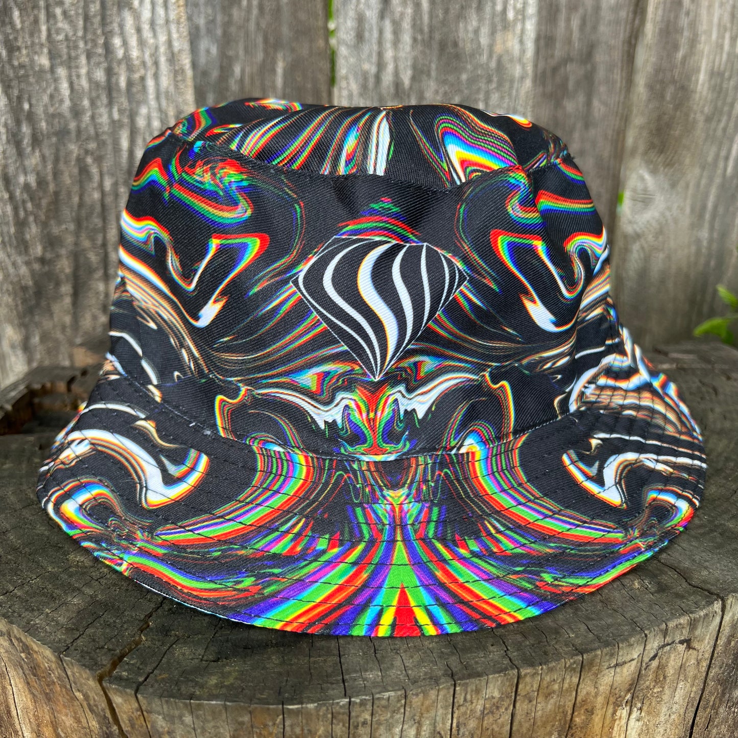 Reversible bucket hat by Drip Drop Labs featuring bold patterns and versatile style, shown in a close-up image.