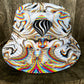 Reversible bucket hat by Drip Drop Labs featuring vibrant patterns and casual style, perfect for sun protection and fashion.