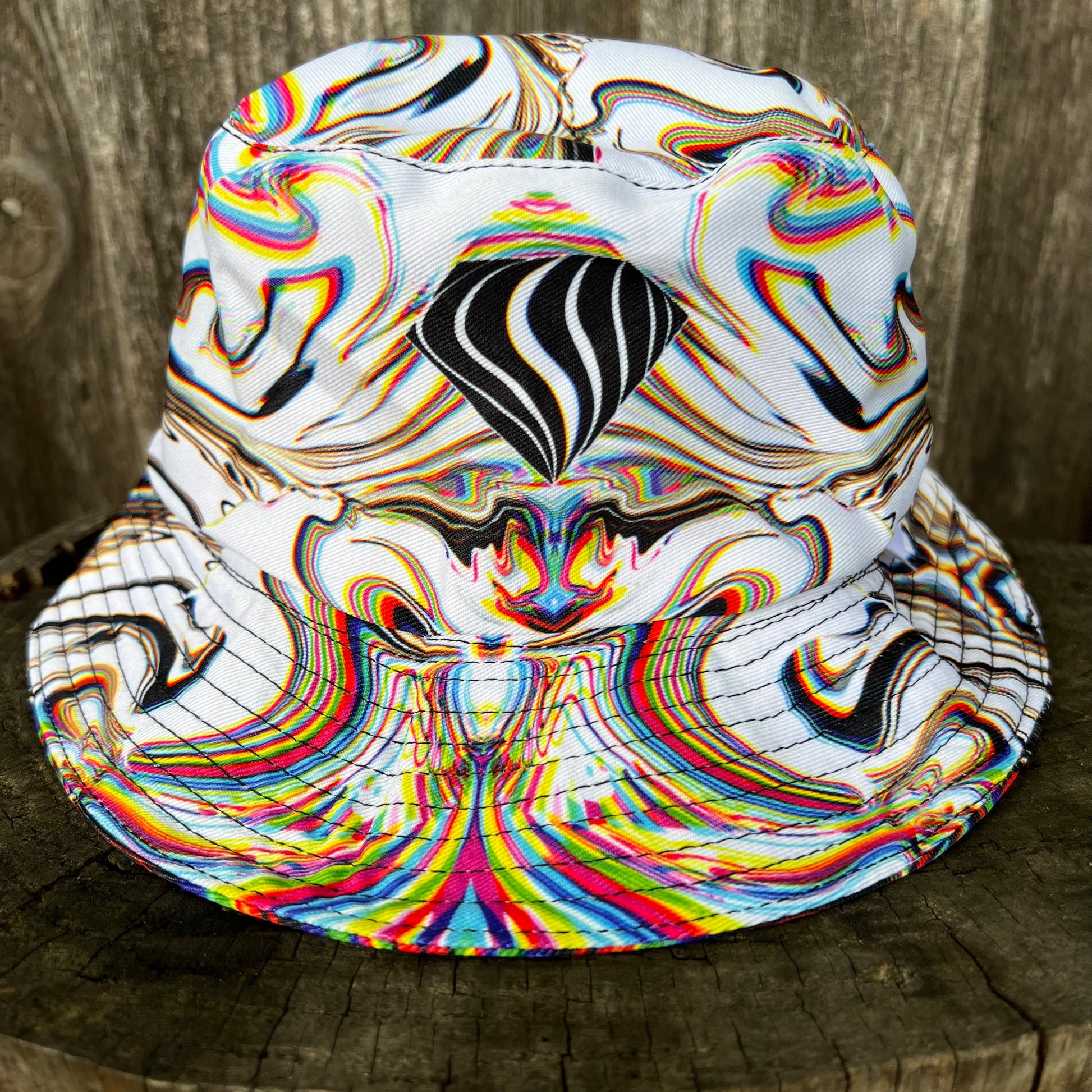 Reversible bucket hat by Drip Drop Labs featuring vibrant patterns and casual style, perfect for sun protection and fashion.