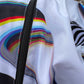White Super Future windbreaker by Drip Drop Labs, lightweight outdoor jacket with a sleek design and adjustable hood.