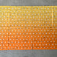Drip Drop Labs Thunderfly Pashmina scarf featuring soft, lightweight fabric in vibrant colors, draped elegantly.