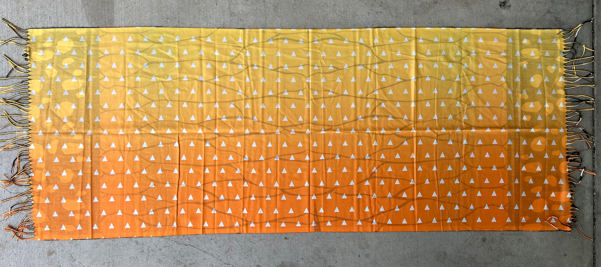 Drip Drop Labs Thunderfly Pashmina scarf featuring soft, lightweight fabric in vibrant colors, draped elegantly.