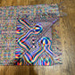 Soft Vibrationz Pashmina scarf by Drip Drop Labs in rich, warm fabric with intricate woven patterns, draped elegantly.