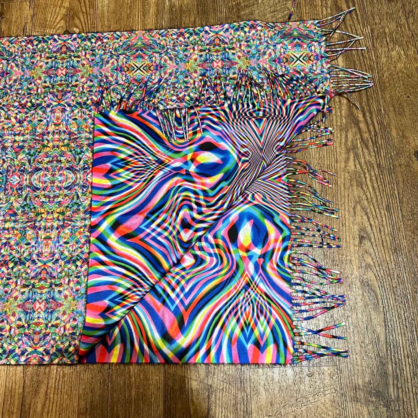 Soft Vibrationz Pashmina scarf by Drip Drop Labs in rich, warm fabric with intricate woven patterns, draped elegantly.