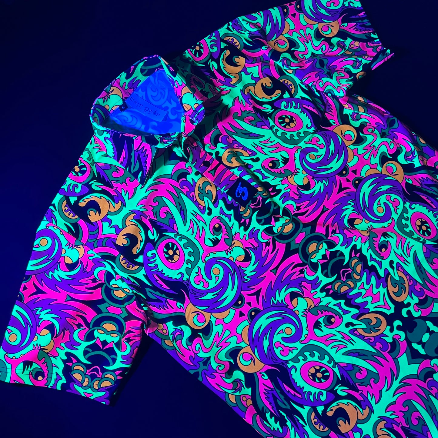 Drip Drop Labs Wild Forest UV Polo shirt with forest-themed pattern and short sleeves, designed for sun protection and style.