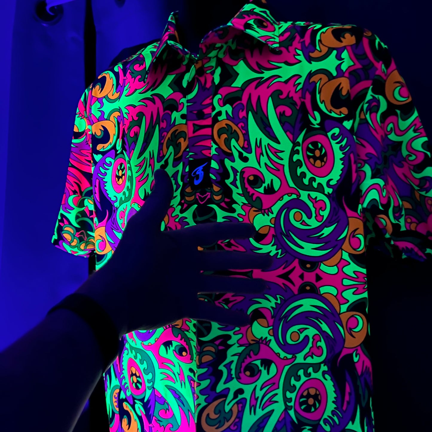 Wild Forest UV Polo by Drip Drop Labs featuring a forest-themed design, short sleeves, and breathable fabric for casual wear.