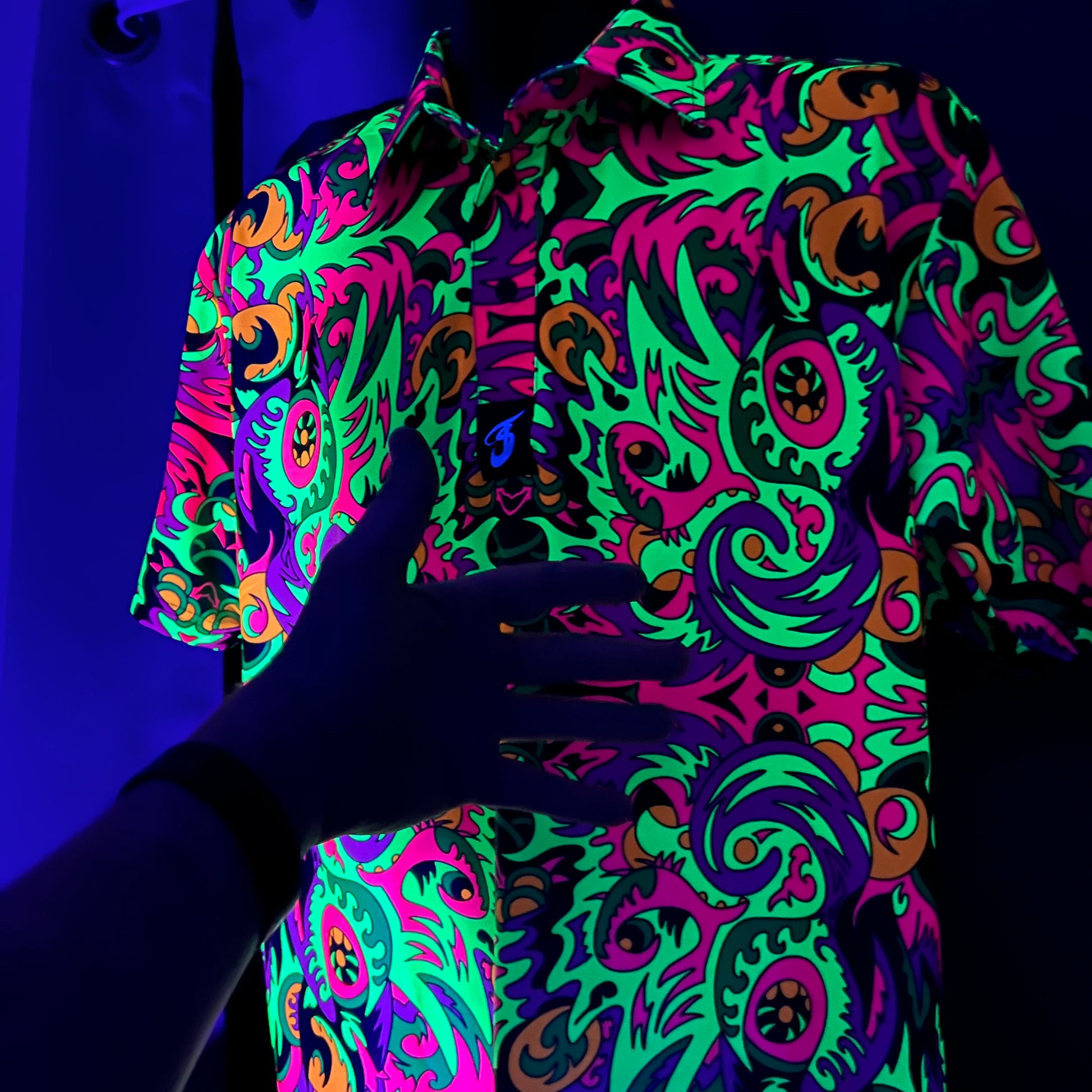 Wild Forest UV Polo by Drip Drop Labs featuring a forest-themed design, short sleeves, and breathable fabric for casual wear.