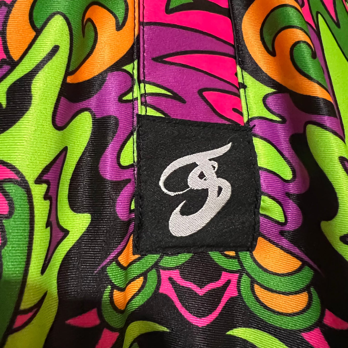 Drip Drop Labs Wild Forest UV Polo showing a stylish polo shirt with a vibrant wild forest print and UV protection fabric.