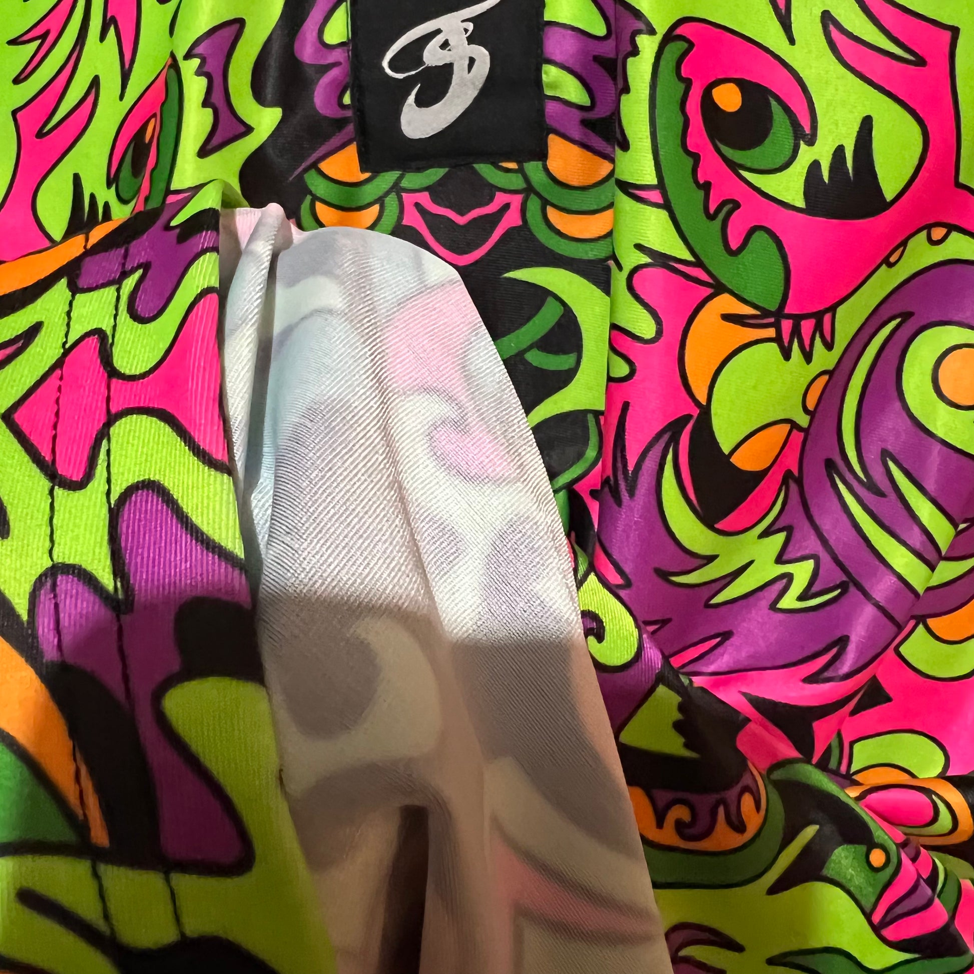 Drip Drop Labs Wild Forest UV Polo shirt featuring a vibrant forest-themed pattern and short sleeves.