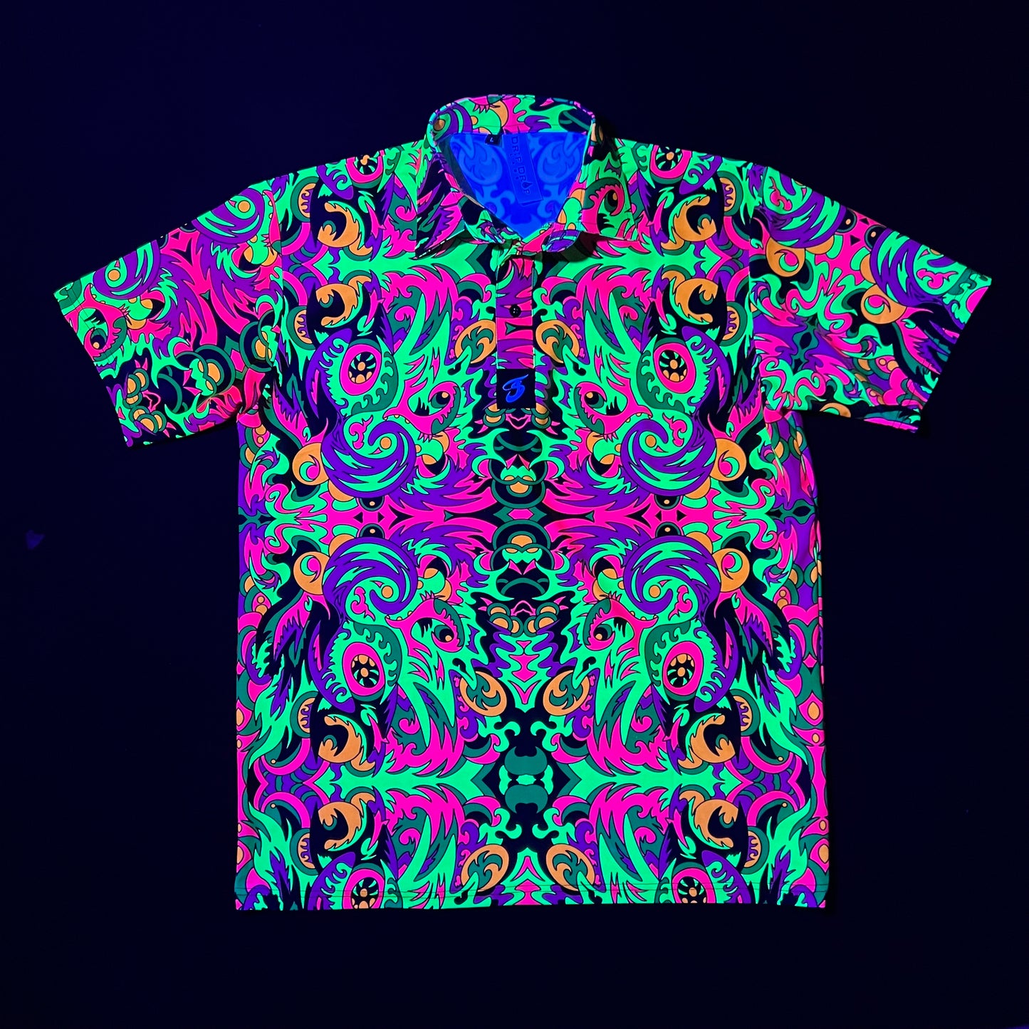 Drip Drop Labs Wild Forest UV Polo showing a vibrant, patterned polo shirt with forest-inspired design and UV protection features.